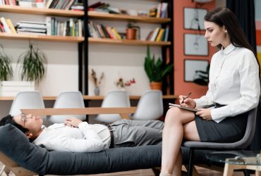 woman therapist consults office worker on a couch